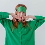 woman wearing green eye mask and green pyjamas
